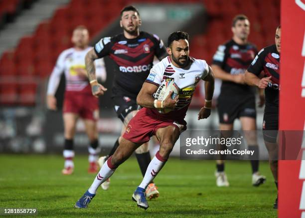 Bevan French of Wigan runs in to score his 3rd try during the Betfred Super League match between Wigan Warriors and Salford Red Devils at Totally...
