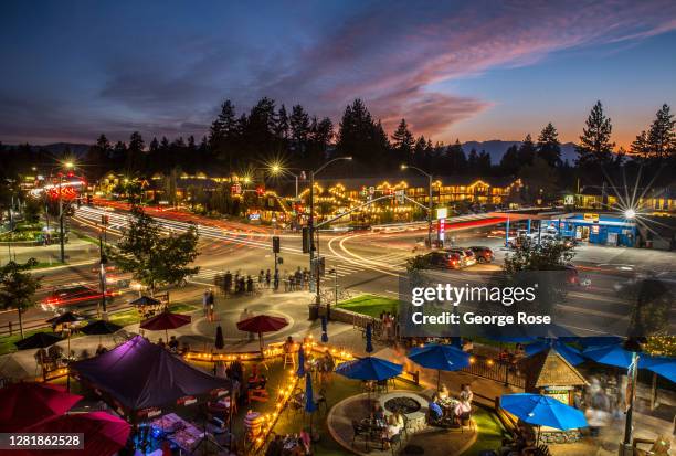 Time exposure taken at the corner of Highway 50 and Heavenly Way shows busy traffic patterns and people dining on August 9 in South Lake Tahoe,...