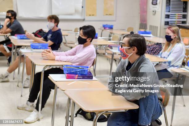 West Lawn, PA Students in Robin Timpson's honors chemistry class where the desks in the classroom are doubled to provide extra spacing. At Wilson...