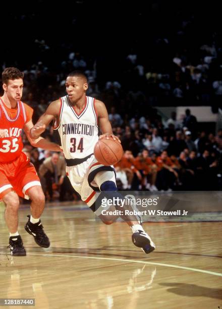 University of Connecticut's star guard Ray Allen drives past a defender during a game against Big East rival Syracuse, Hartford, CT 1995.