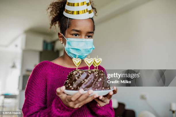 african american girl celebrating birthday during epidemic - sad birthday stock pictures, royalty-free photos & images