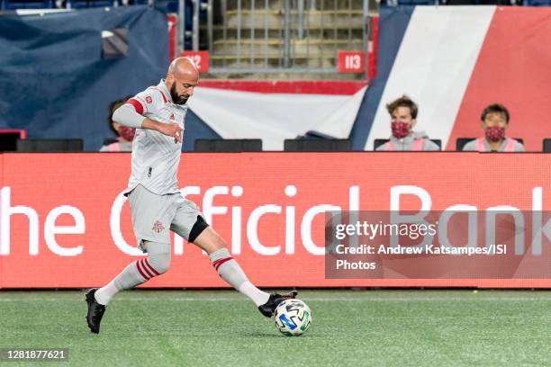 Laurent Ciman of Toronto FC passes back to goalkeeper during a game between Toronto FC and New England Revolution at Gillette Stadium on October 7,...