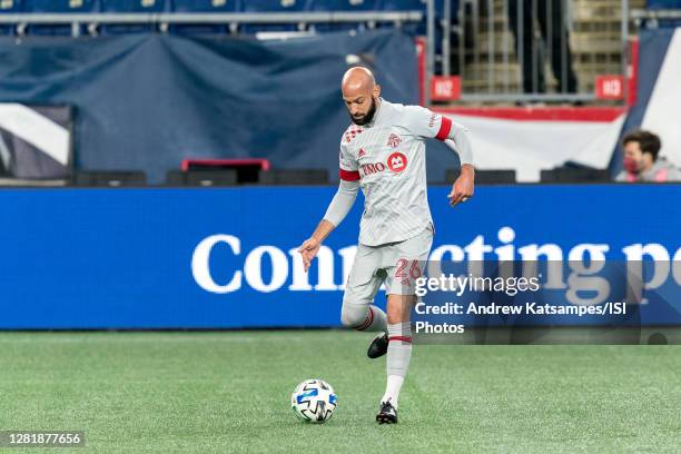 Laurent Ciman of Toronto FC passes the ball during a game between Toronto FC and New England Revolution at Gillette Stadium on October 7, 2020 in...