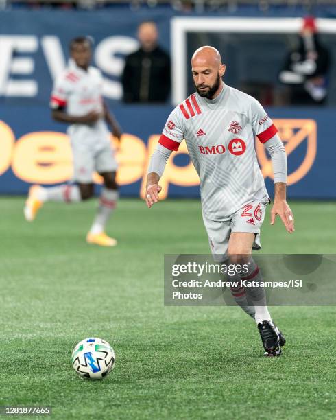 Laurent Ciman of Toronto FC passes the ball during a game between Toronto FC and New England Revolution at Gillette Stadium on October 7, 2020 in...