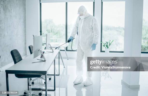 office disinfection during covid-19 pandemic. - decontamination stock pictures, royalty-free photos & images