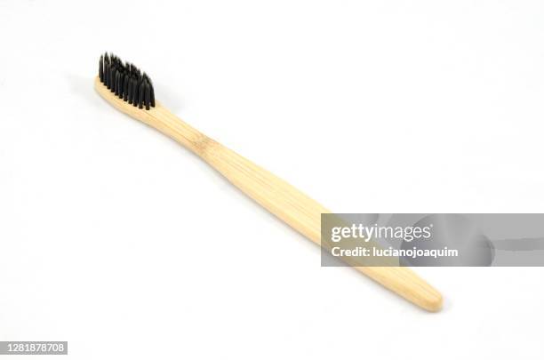 bamboo toothbrush - toothbrush ストックフォトと画像