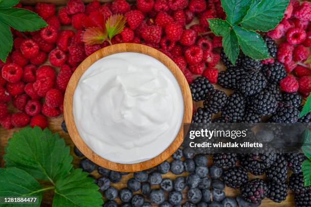 healthy breakfast with fresh greek yogurt on background. - blackberry fruit on white stock pictures, royalty-free photos & images