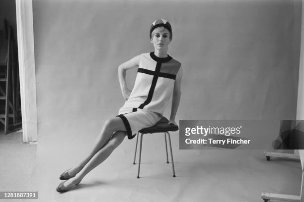 Model wearing a day dress from the Mondrian collection of French fashion designer Yves Saint Laurent, 23rd August 1965. The collection was inspired...