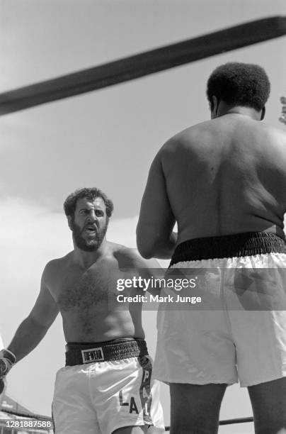 Lyle Alzado , squares off against Muhammad Ali during an eight-round exhibition match at Mile High Stadium on July 14, 1979 in Denver, Colorado....