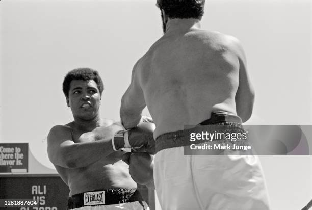 Muhammad Ali , blocks a punch from Lyle Alzado during an eight-round exhibition match at Mile High Stadium on July 14, 1979 in Denver, Colorado. Ali...