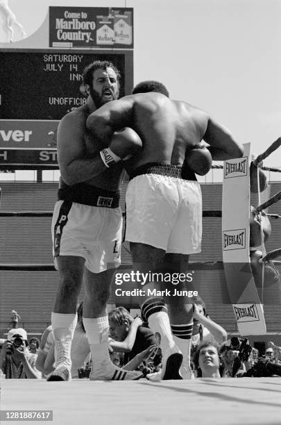 Lyle Alzado and Muhammad Ali lock up in a clinch during an eight-round exhibition match at Mile High Stadium on July 14, 1979 in Denver, Colorado....