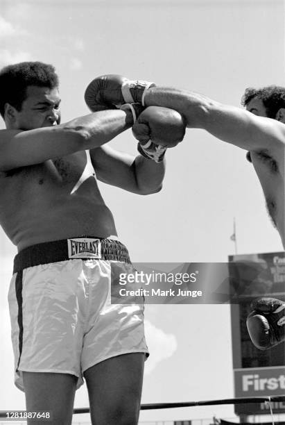Muhammad Ali , blocks a left jab from Lyle Alzado during an eight-round exhibition match at Mile High Stadium on July 14, 1979 in Denver, Colorado....