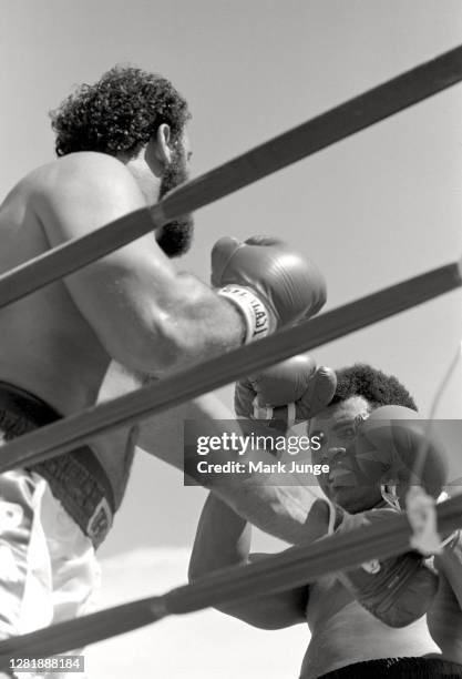 Muhammad Ali , blocks a left jab from Lyle Alzado during an eight-round exhibition match at Mile High Stadium on July 14, 1979 in Denver, Colorado....