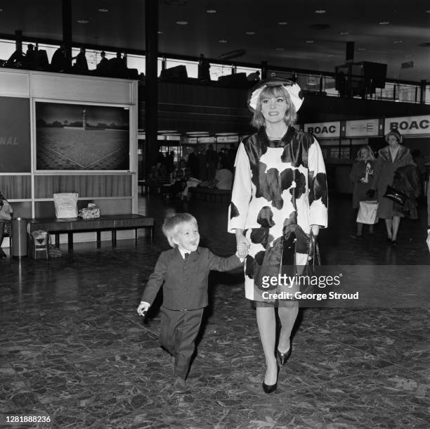 Australian actress Diane Cilento with her son Jason Connery at London Airport, UK, 29th October 1965.