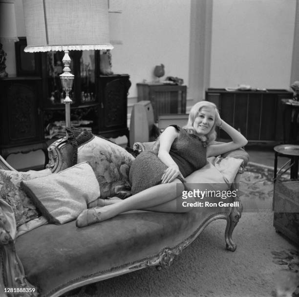 English singer Janie Jones relaxing at home, after being acquitted on a blackmail charge, UK, 28th September 1966.