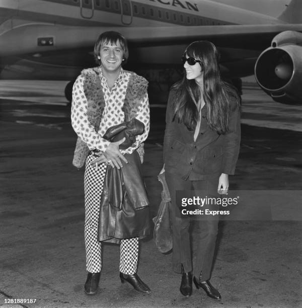 American rock duo Sonny and Cher arrive at London Airport, UK, 22nd July 1966. They are husband and wife Sonny Bono and Cher.