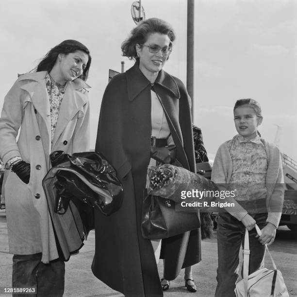American actress Grace Kelly with her daughters, Caroline and Stéphanie at London Airport, UK, 28th March 1973.
