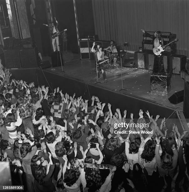 British rock band Slade in concert at the London Palladium, UK, 7th January 1973. From left to right, bass player Jim Lea, singer Noddy Holder,...