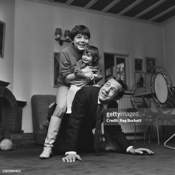 English actor Ian Hendry with his wife, actress Janet Munro and their daughter Sally, UK, 9th December 1965.