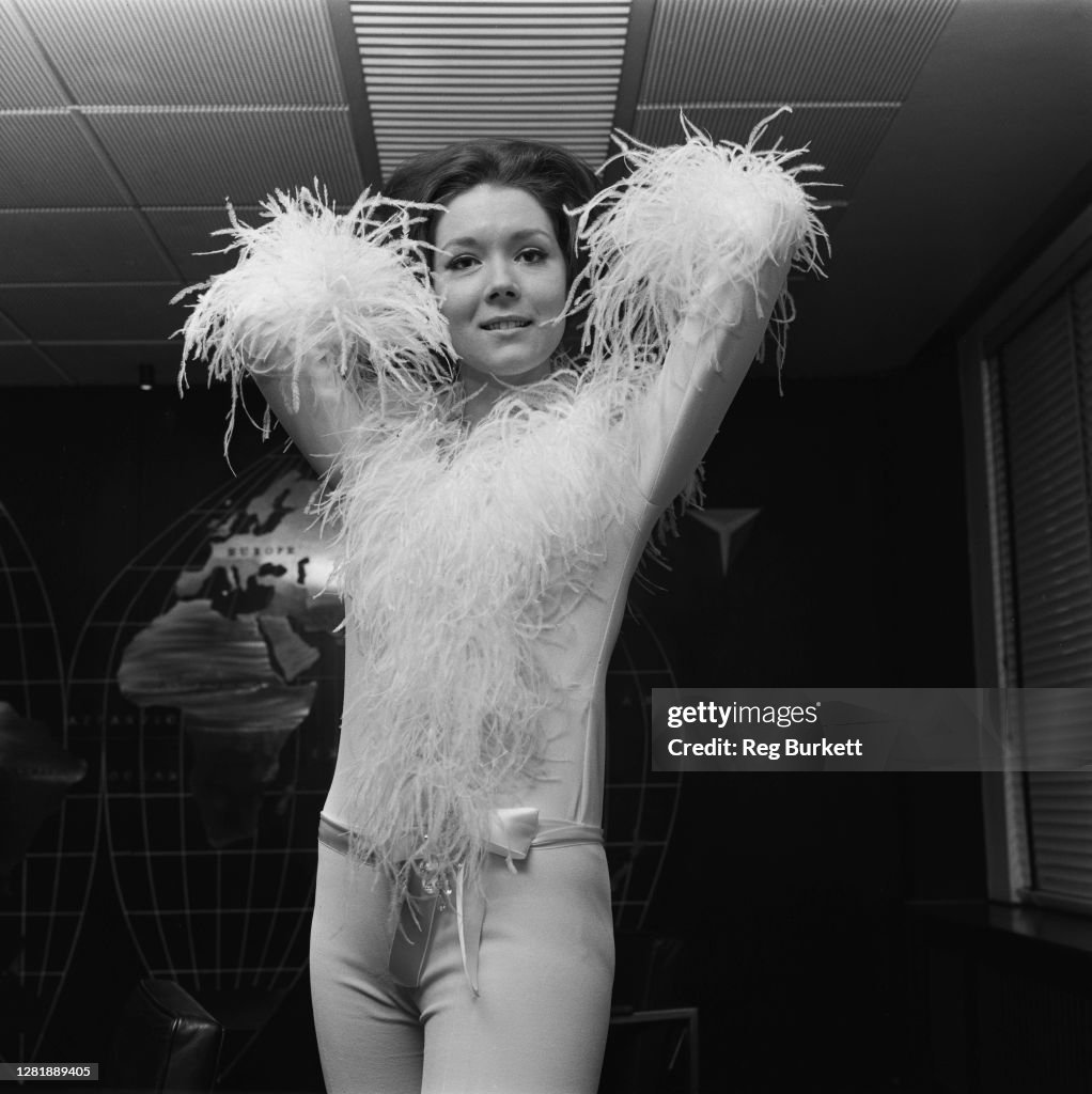 Angiediana Rigg English actress Diana Rigg modelling her outfit for her appearance on ...