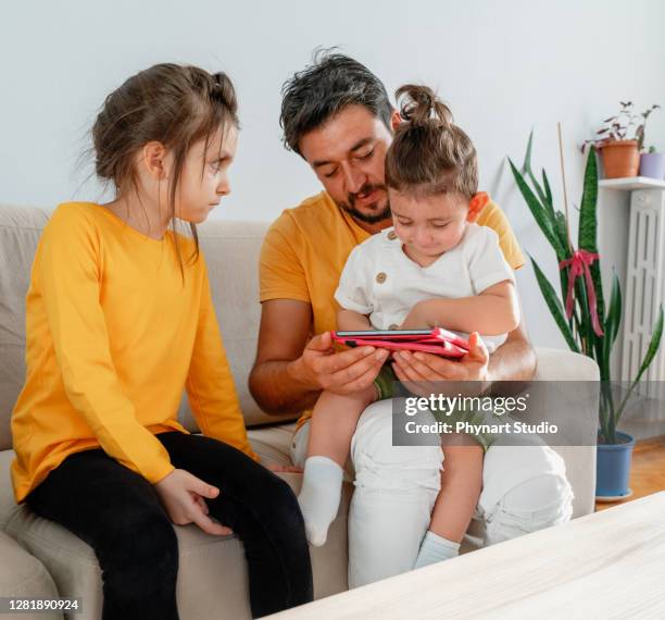 little girl annoyed with his family - sibling jealousy stock pictures, royalty-free photos & images