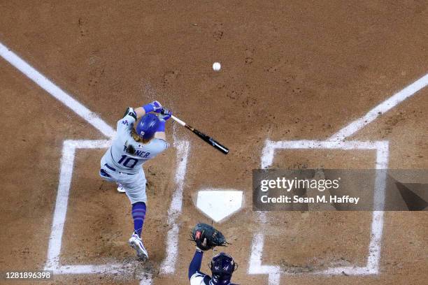 Justin Turner of the Los Angeles Dodgers hits a solo home run against the Tampa Bay Rays during the first inning in Game Three of the 2020 MLB World...