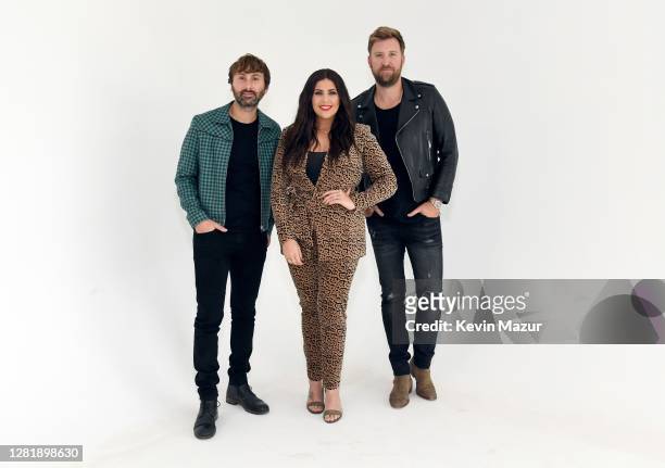 In this image released on October 23, Dave Haywood, Hillary Scott, and Charles Kelley of Lady A pose for a portrait for the 2020 iHeartCountry...
