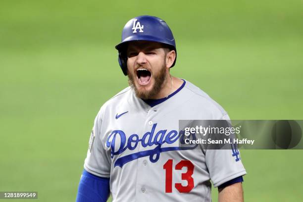 Max Muncy of the Los Angeles Dodgers celebrates after hitting a two-run single against the Tampa Bay Rays during the third inning in Game Three of...