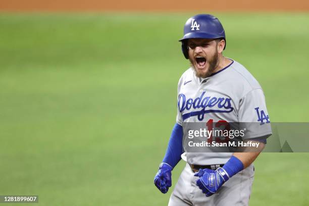 Max Muncy of the Los Angeles Dodgers celebrates after hitting a two-run single against the Tampa Bay Rays during the third inning in Game Three of...