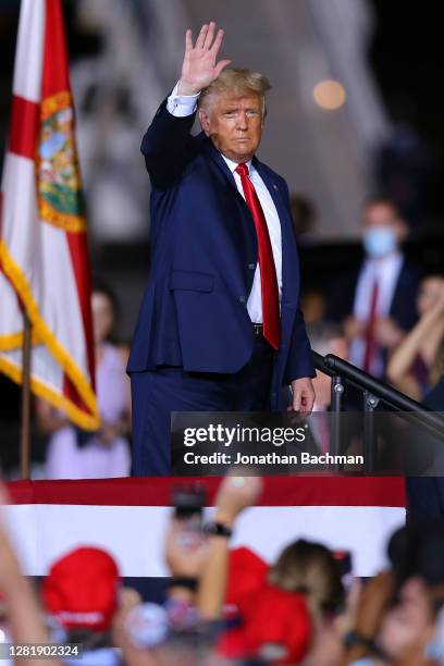 President Donald Trump waves to supporters after a rally on October 23, 2020 in Pensacola, Florida. With less than two weeks before the general...