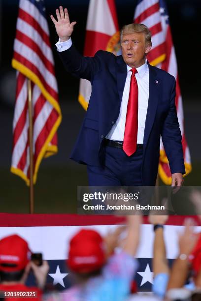 President Donald Trump waves to supporters after a rally on October 23, 2020 in Pensacola, Florida. With less than two weeks before the general...
