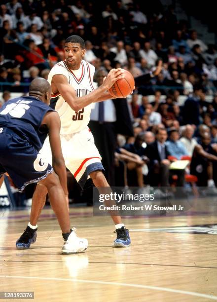 UConn's Rip Hamilton looks to make a move on a Georgetown University defender, Hartford CT 1999.