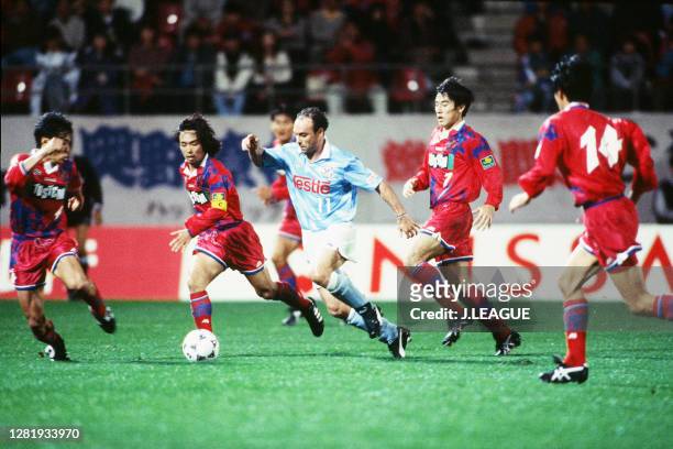 Salvatore Schillaci of Jubilo Iwata competes for the ball against Kashima Antlers defense during the J.League match between Kashima Antlers and...