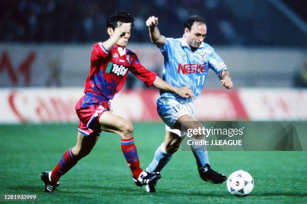 Salvatore Schillaci of Jubilo Iwata and Ryosuke Okuno of Kashima Antlers compete for the ball during the J.League match between Kashima Antlers and...