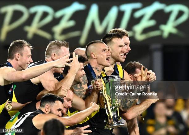 The Tigers celebrate with the Premiership Cup after winning the 2020 AFL Grand Final match between the Richmond Tigers and the Geelong Cats at The...