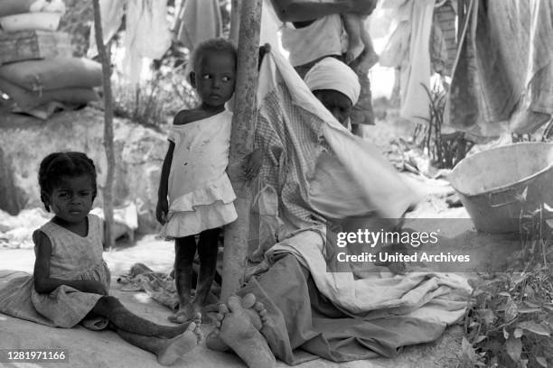 Grandmother menidng clothes, 1967.