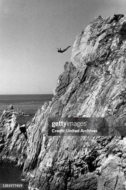 Travel to Mexico - La Quebrada Cliff Diver in Acapulco. The jump and high diving from the cliffs of La Quebrada into the "Gulch" sea below. Image...