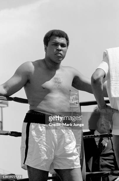 Muhammad Ali stands in his corner and stares at the photographer during an eight-round exhibition match with Lyle Alzado at Mile High Stadium on July...