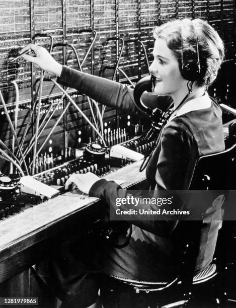 Werk 1962 - VW Werk, Wolfsburg, 1962. A lady from the Volkswagen Factory telephone switchboard in Wolfsburg .