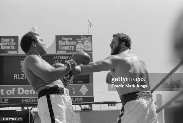 Muhammad Ali , blocks a jab from Lyle Alzado during an eight-round exhibition match at Mile High Stadium on July 14, 1979 in Denver, Colorado. Ali...