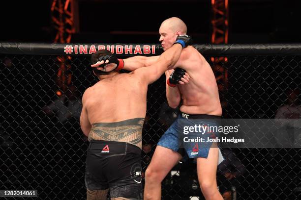 Tai Tuivasa of Australia punches Stefan Struve of The Netherlands in their heavyweight bout during the UFC 254 event on October 24, 2020 on UFC Fight...