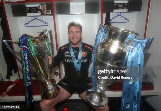 Stuart Hogg of Exeter Chiefs poses for a photo with the Gallagher Premiership Trophy and Heineken Champions Cup following his team's victory in the...