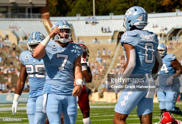 Sam Howell of the North Carolina Tar Heels reacts after scoring a touchdown against the North Carolina State Wolfpack during their game at Kenan...