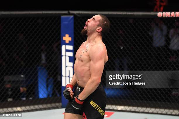 Robert Whittaker of Australia reacts after the conclusion of his middleweight bout against Jared Cannonier during the UFC 254 event on October 25,...