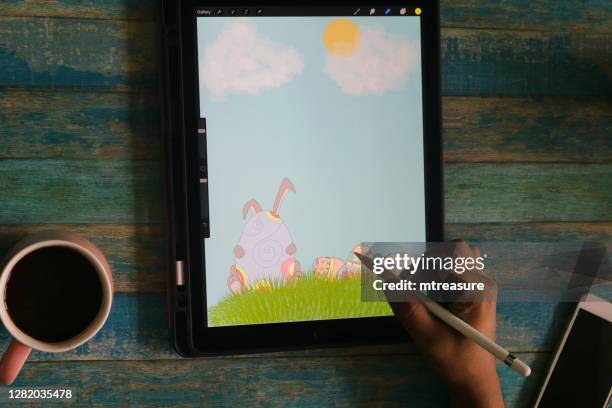 image of sketch of easter bunny and egg drawn by unrecognised man, drawing illustration / digital artwork on tablet / computer with stylus pencil, male artist sketching, simple artwork sketch flat design vector illustration - easter bunny man stock pictures, royalty-free photos & images