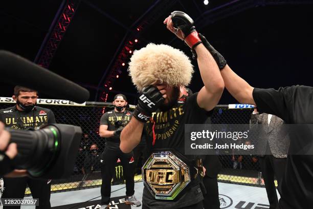 Khabib Nurmagomedov of Russia celebrates his victory over Justin Gaethje in their lightweight title bout during the UFC 254 event on October 25, 2020...