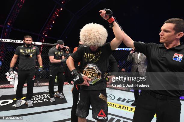 Khabib Nurmagomedov of Russia celebrates his victory over Justin Gaethje in their lightweight title bout during the UFC 254 event on October 25, 2020...