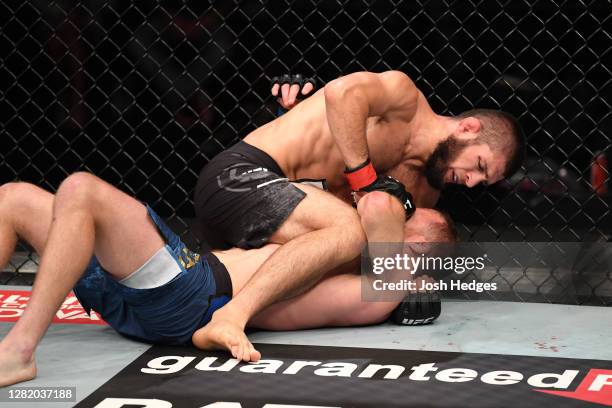 Khabib Nurmagomedov of Russia attempts to submit Justin Gaethje in their lightweight title bout during the UFC 254 event on October 25, 2020 on UFC...