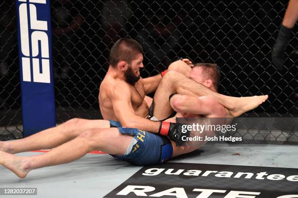 Khabib Nurmagomedov of Russia attempts to submit Justin Gaethje in their lightweight title bout during the UFC 254 event on October 25, 2020 on UFC...