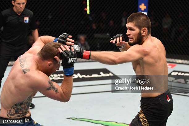 Khabib Nurmagomedov of Russia punches Justin Gaethje in their lightweight title bout during the UFC 254 event on October 25, 2020 on UFC Fight...